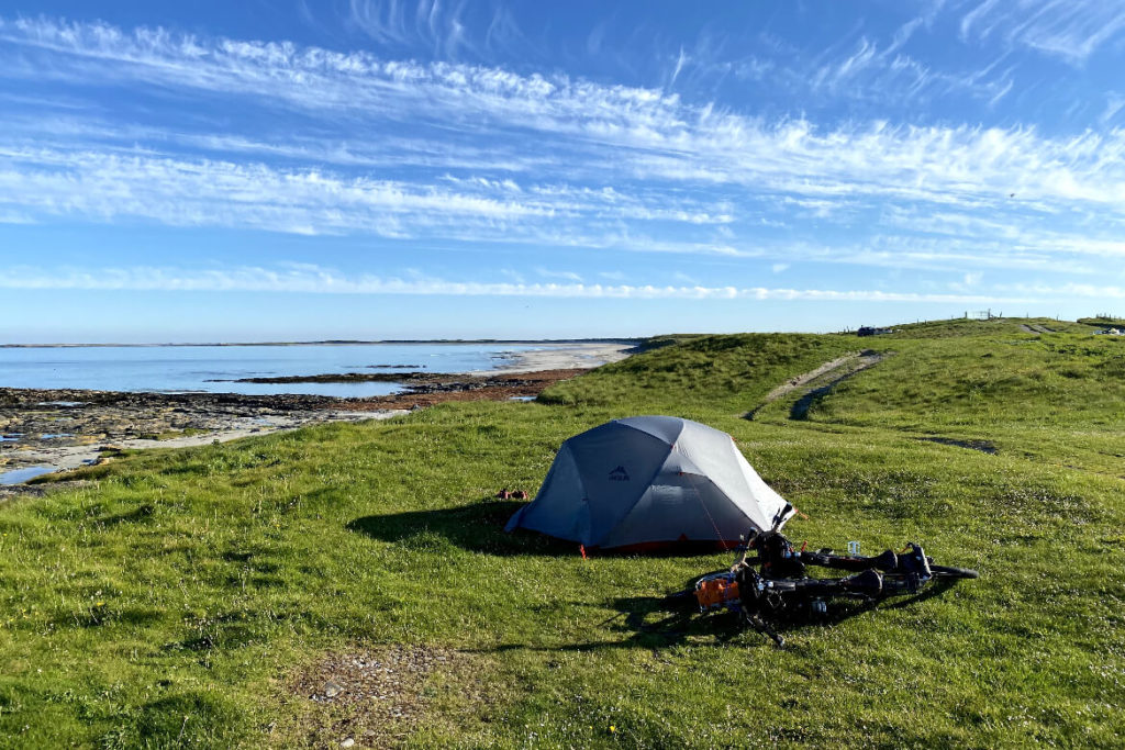 tent and two bikes pitched up near Kildonan beach